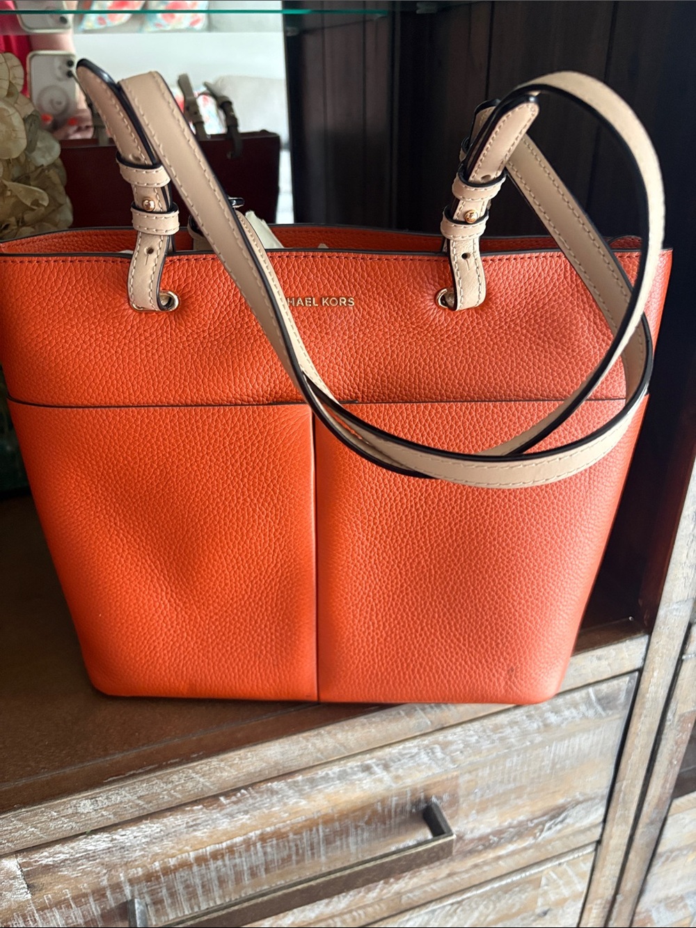 Michael Kors Orange Pebbled Leather shoulder bag with Cream Handles